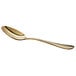 An Acopa Vernon stainless steel spoon with a gold handle.