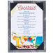 A white Menu Solutions Alumitique table tent with a black frame displaying a menu of cocktails.