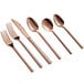 A close-up of a set of Acopa Phoenix rose gold stainless steel bouillon spoons.