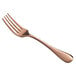 A close-up of a rose gold Vernon dinner fork.