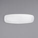 a white plate on a gray background