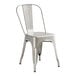 A Lancaster Table & Seating silver metal cafe chair.