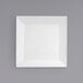 A white square plate on a gray background.