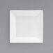 A white square plate on a grey background.