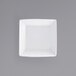 A white square bowl with a grey background.
