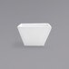 A Front of the House Kyoto bright white tall square porcelain bowl on a grey surface.