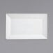 A bright white rectangular porcelain plate.