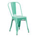 A Lancaster Table & Seating aquamarine metal outdoor cafe chair.