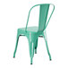 A turquoise metal outdoor cafe chair with black legs.