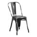 A Lancaster Table & Seating black metal outdoor cafe chair with a seat and back.