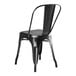 A black metal Lancaster Table & Seating outdoor cafe chair with a backrest.