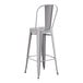 A Lancaster Table & Seating gray metal outdoor cafe bar stool with a backrest.