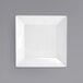 A white square porcelain bowl with a square edge on a white background.