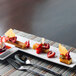 A Front of the House Kyoto porcelain plate with dessert, strawberries, and ice cream with a spoon