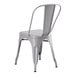 A Lancaster Table & Seating gray metal outdoor cafe chair with a backrest.