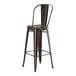 A brown metal Lancaster Table & Seating outdoor cafe bar stool with a backrest.