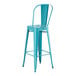 A turquoise metal outdoor cafe barstool with a backrest.