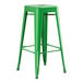 A green metal Lancaster Table & Seating outdoor backless barstool.