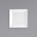 A white square plate on a gray background.