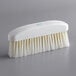 A white Ateco bench brush with blue bristles.