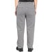 A person wearing Uncommon Chef houndstooth chef pants.