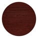 A 36-inch round laminated table top with a reversible cherry and black finish.