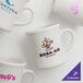 A group of Acopa ivory stoneware coffee mugs with logos on them.