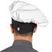 a person wearing a chef hat