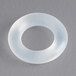 A white plastic ring with a grey center.