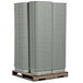 A stack of Tablecraft gray plastic bus tubs on a pallet.