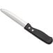 A Choice steak knife with a black handle.