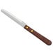 A Choice stainless steel steak knife with a wooden handle.