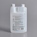 A white plastic container of Urnex Clearly Cold Coffee Equipment Cleaner with black text and instructions.