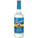 A Torani Sugar-Free White Chocolate flavoring syrup bottle with a blue label.