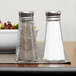 Two Thunder Group mushroom top salt and pepper shakers on a table.