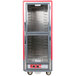 A red metal Metro C5 heated holding cabinet with clear Dutch doors.