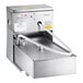 A Frymaster portable fryer oil filtration machine with a stainless steel tank and a hose.