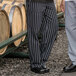 Two men wearing Uncommon Chef black and white striped cargo pants.