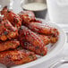 A plate of Frank's RedHot seasoned chicken wings.