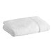 A white Lavex bath towel rolled up.