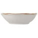 A Tuxton TuxTrendz China bowl with a white interior and gold rim.