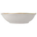 A white Tuxton china bowl with gold trim on the rim.