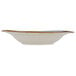 A white china soup bowl with a wide brown rim.