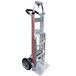 A silver Magliner hand truck with black wheels and a red handle.