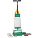 A Bissell Commercial low speed rotary floor machine with two brushes on it.