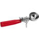 A metal ice cream scoop with a red handle.