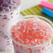 Two cups of bubble tea with Bossen Cherry Blossom Crystal Boba in pink syrup.