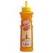 A close up of a Master of Mixes Mango Syrup bottle with a yellow cap.