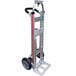 A silver Magliner hand truck with black wheels.