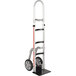 A silver and black Magliner narrow aisle hand truck with wheels and a curved back frame and single pin handle.